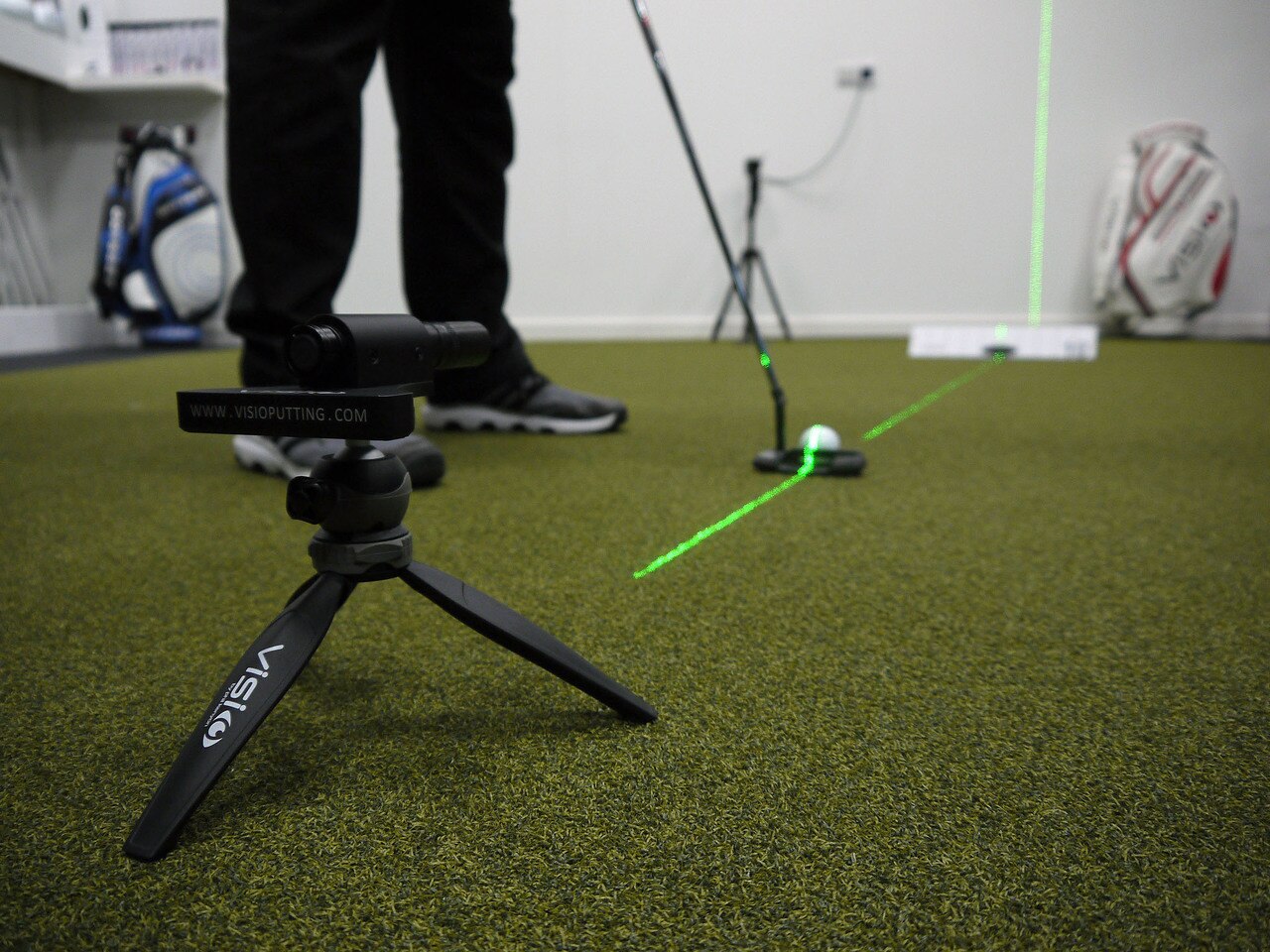 Golfer using laser putting aid